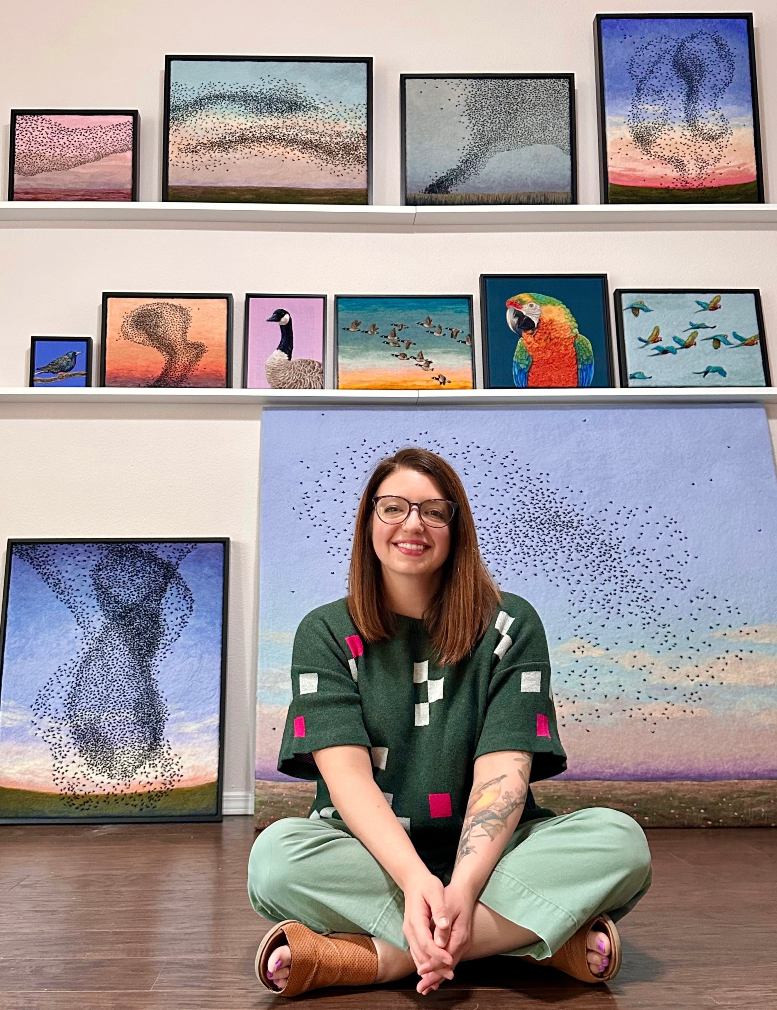 Dani_Ives_Fiber_Artist_with_Embroideried_pieces_behind_her_in_NWA_arkansas.jpg