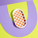 Squiggle Cutters 3D printed jewelry and catch all checkerboard tray on a bright background - ellipse shape
